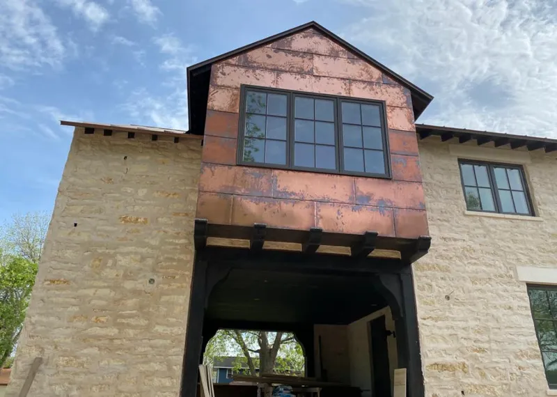 Copper metal panel facade on a stone building for Skylight Installation in Chevy Chase
